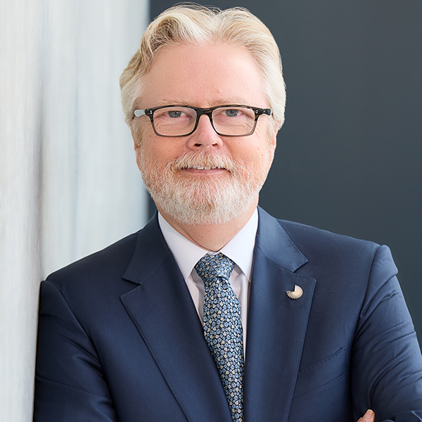 Portrait of a man with white hair, glasses and a beard, Dr. Joe Ramos
